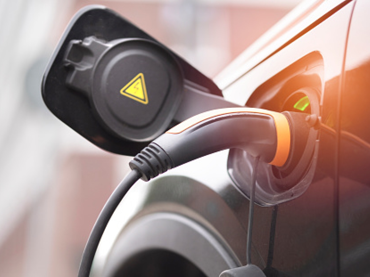 Electric vehicle plugged in Electric vehicle plugged in